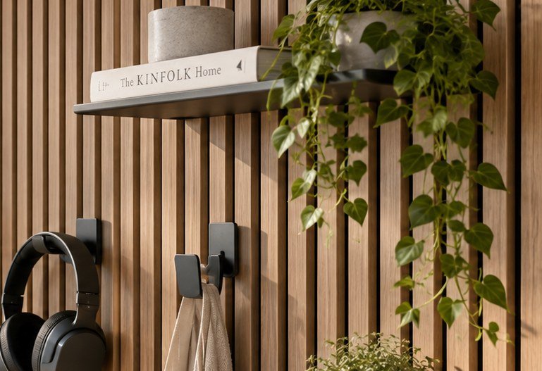 Close-up of a shelf and storage accessories on an acoustic slat wall